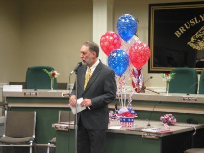 Man talking after the ceremony with balloons